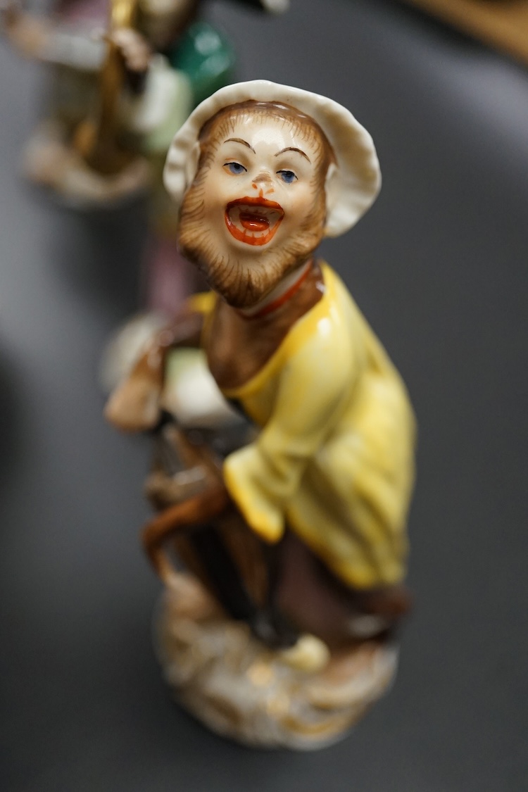 A group of twenty German porcelain monkey band figures, largest 15.5cm high